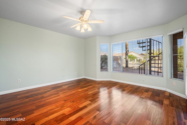 11562 N Scioto Ave, Tucson, AZ 85737 - spare room with healthy amount of natural light, wood finished floors, baseboards, and ceiling fan