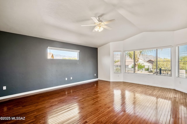 11562 N Scioto Ave, Tucson, AZ 85737 - unfurnished room featuring wood-type flooring, vaulted ceiling, ceiling fan, and baseboards