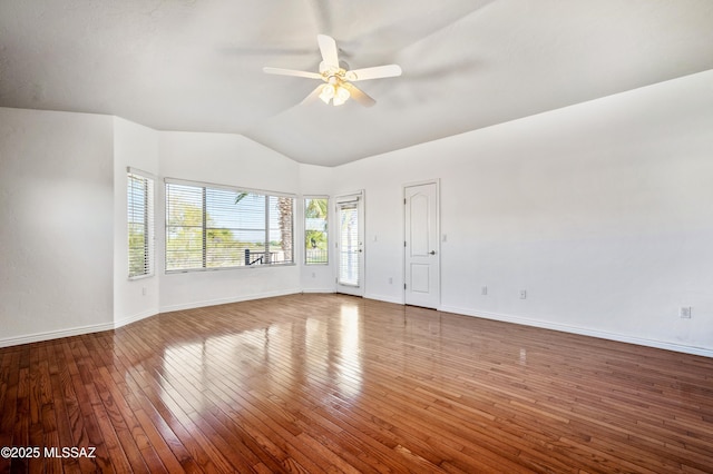11562 N Scioto Ave, Tucson, AZ 85737 - unfurnished living room with vaulted ceiling, a ceiling fan, hardwood / wood-style floors, and baseboards