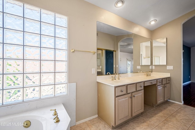 11562 N Scioto Ave, Tucson, AZ 85737 - bathroom with double vanity, a bath, tile patterned floors, and baseboards