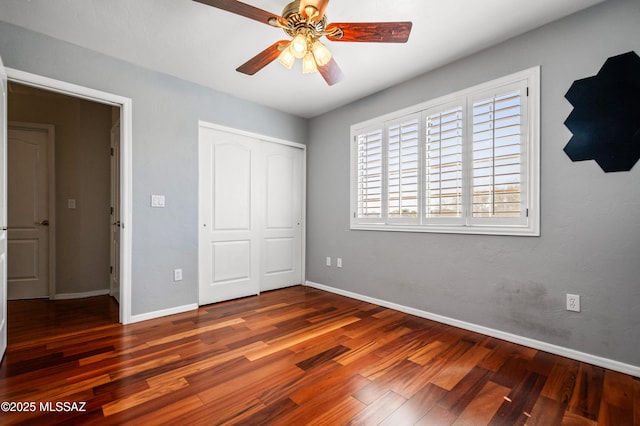 11562 N Scioto Ave, Tucson, AZ 85737 - unfurnished bedroom featuring wood finished floors, a closet, baseboards, and a ceiling fan