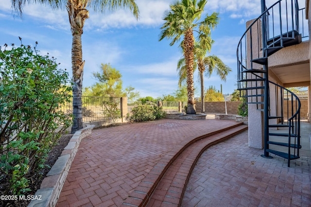 11562 N Scioto Ave, Tucson, AZ 85737 - fenced backyard featuring stairs and a patio area
