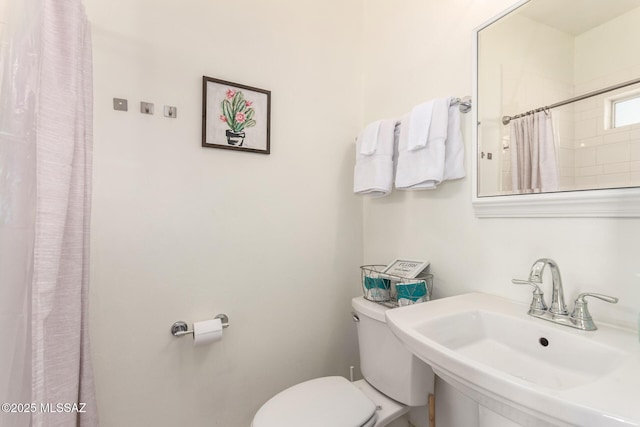 118 N Hoff Ave, Tucson, AZ 85705 - bathroom with a sink, toilet, and a shower with curtain