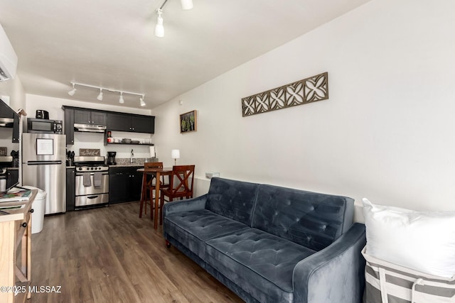 118 N Hoff Ave, Tucson, AZ 85705 - living area with rail lighting and dark wood finished floors