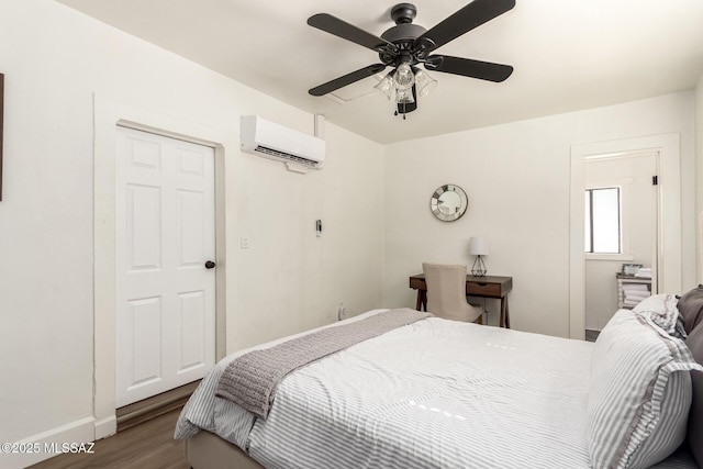 118 N Hoff Ave, Tucson, AZ 85705 - bedroom with a wall mounted air conditioner, wood finished floors, baseboards, and ceiling fan