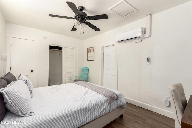 118 N Hoff Ave, Tucson, AZ 85705 - bedroom featuring a wall unit AC, attic access, wood finished floors, a closet, and baseboards
