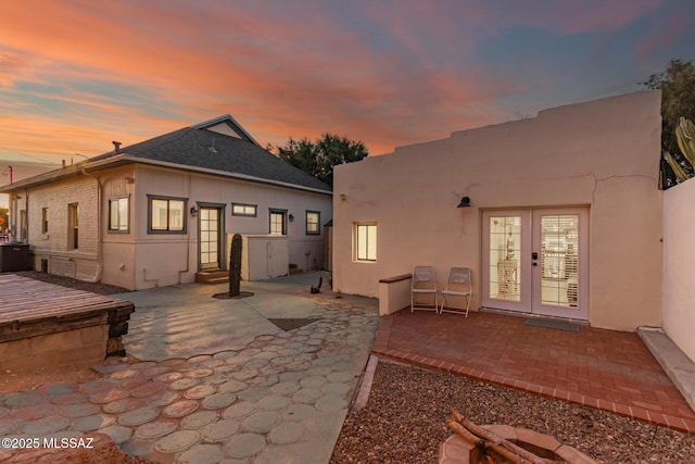 118 N Hoff Ave, Tucson, AZ 85705 - rear view of property featuring french doors, a patio, and stucco siding