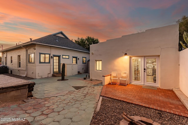 118 N Hoff Ave, Tucson, AZ 85705 - rear view of property featuring french doors, a patio area, entry steps, and stucco siding