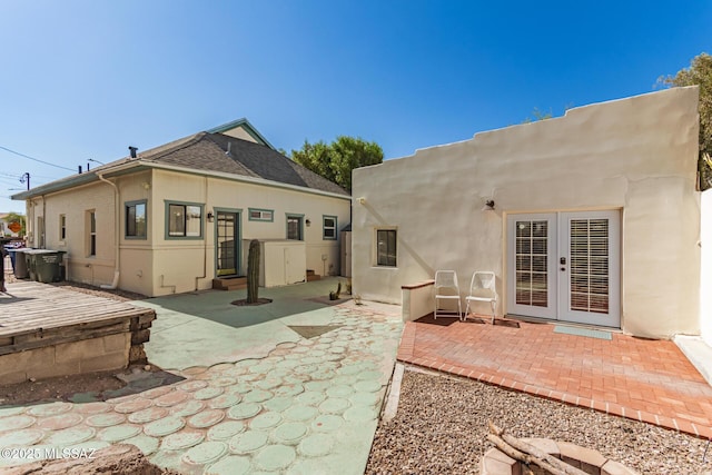 118 N Hoff Ave, Tucson, AZ 85705 - back of property featuring french doors, a patio, and stucco siding