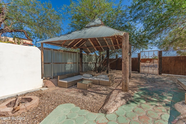 118 N Hoff Ave, Tucson, AZ 85705 - fenced backyard with a gazebo, an outdoor living space with a fire pit, and a patio area