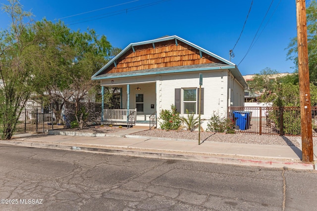 118 N Hoff Ave, Tucson, AZ 85705 - shotgun-style home with covered porch and a ceiling fan