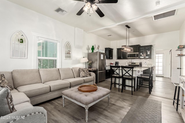 118 N Hoff Ave, Tucson, AZ 85705 - living room with a ceiling fan and light wood-style floors