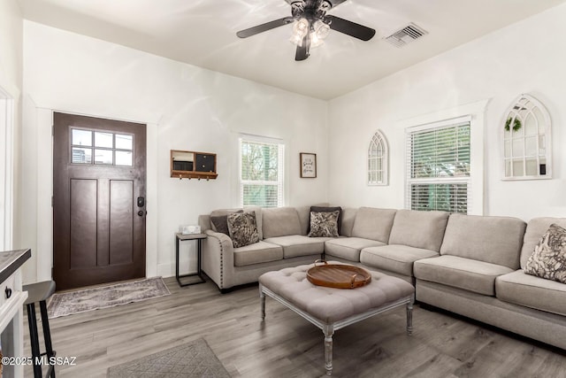 118 N Hoff Ave, Tucson, AZ 85705 - living area featuring healthy amount of natural light, a ceiling fan, and light wood-style floors