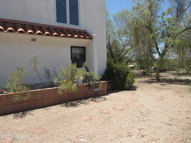 11985 N Cayce Ln, Casa Grande, AZ 85194 - view of home's exterior featuring stucco siding and a tiled roof