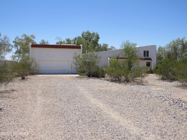 11985 N Cayce Ln, Casa Grande, AZ 85194 - view of front of property with driveway, stucco siding, and a garage