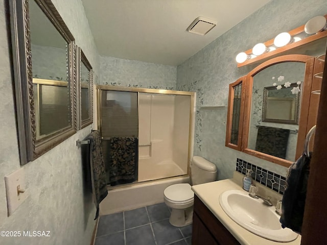 11985 N Cayce Ln, Casa Grande, AZ 85194 - bathroom featuring tile patterned flooring, toilet, vanity, and bath / shower combo with glass door