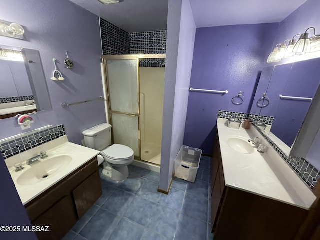 11985 N Cayce Ln, Casa Grande, AZ 85194 - full bathroom with a shower stall, tile patterned floors, toilet, and two vanities