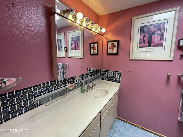 11985 N Cayce Ln, Casa Grande, AZ 85194 - bathroom with tile patterned floors, vanity, and decorative backsplash