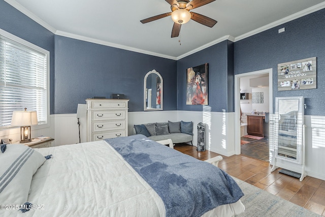 983 N Via Zahara Del Sol, Tucson, AZ 85748 - bedroom with ornamental molding, wood finished floors, wainscoting, a textured wall, and ceiling fan