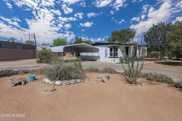 3431 N Edith Blvd, Tucson, AZ 85716 - manufactured / mobile home with a detached carport and driveway