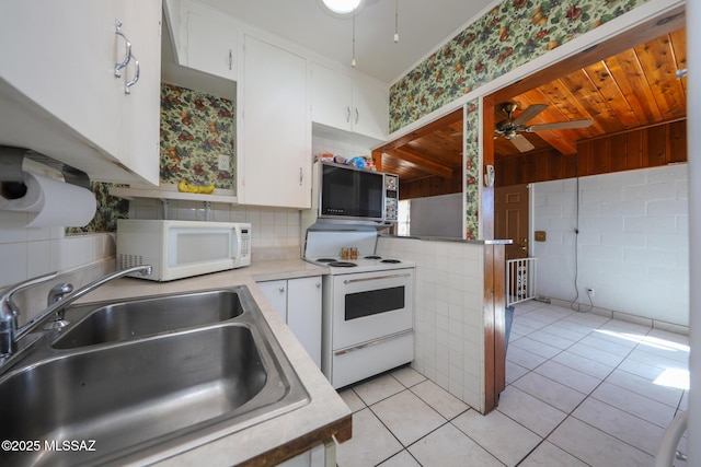 3431 N Edith Blvd, Tucson, AZ 85716 - kitchen with white appliances, a sink, ceiling fan, white cabinetry, and light countertops