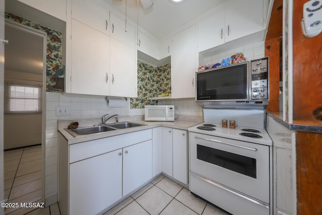 3431 N Edith Blvd, Tucson, AZ 85716 - kitchen with white appliances, a sink, light tile patterned flooring, and white cabinets