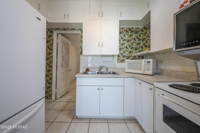 3431 N Edith Blvd, Tucson, AZ 85716 - kitchen featuring white appliances, a sink, light countertops, wallpapered walls, and light tile patterned floors