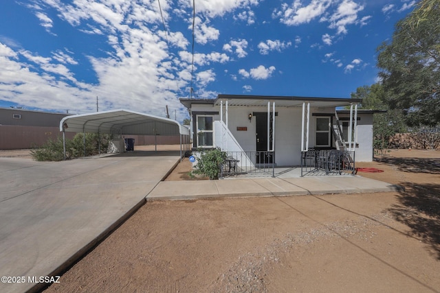 3431 N Edith Blvd, Tucson, AZ 85716 - manufactured / mobile home with a carport, driveway, and covered porch