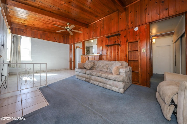 3431 N Edith Blvd, Tucson, AZ 85716 - tiled living area with wood walls, wood ceiling with exposed beams, and ceiling fan