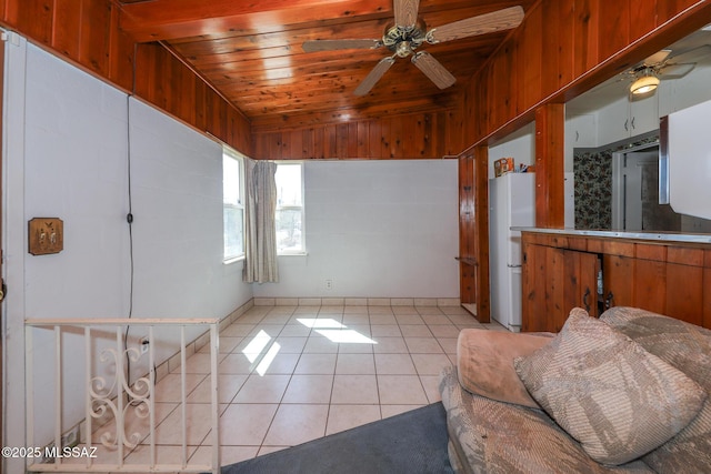 3431 N Edith Blvd, Tucson, AZ 85716 - unfurnished living room with ceiling fan, light tile patterned flooring, and wood ceiling