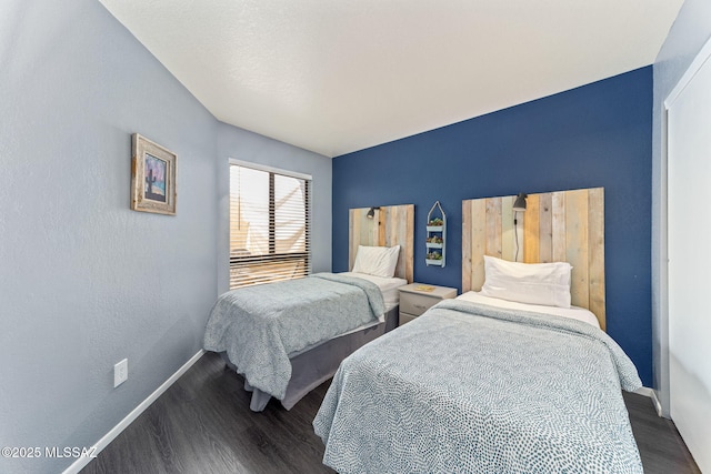 7612 E Callisto Cir Unit 60, Tucson, AZ 85715 - bedroom with dark wood finished floors and baseboards