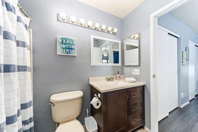7612 E Callisto Cir Unit 60, Tucson, AZ 85715 - bathroom featuring vanity, wood finished floors, and toilet