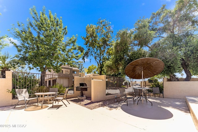 7612 E Callisto Cir Unit 60, Tucson, AZ 85715 - view of patio / terrace featuring outdoor dining area