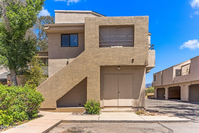 7612 E Callisto Cir Unit 60, Tucson, AZ 85715 - view of front facade featuring stucco siding