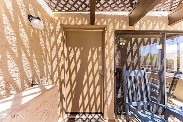7612 E Callisto Cir Unit 60, Tucson, AZ 85715 - doorway to property with stucco siding