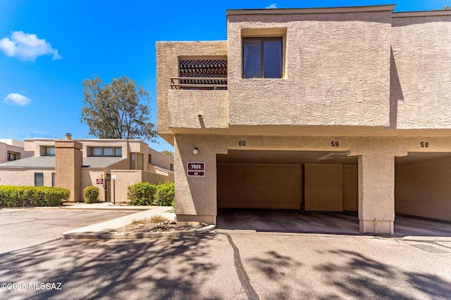7612 E Callisto Cir Unit 60, Tucson, AZ 85715 - multi unit property with stucco siding and a balcony