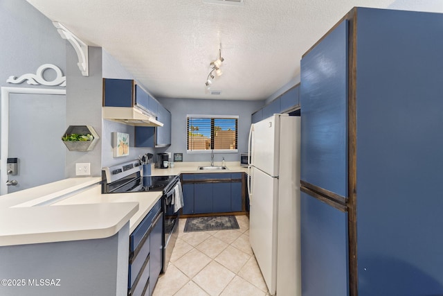 7612 E Callisto Cir Unit 60, Tucson, AZ 85715 - kitchen with freestanding refrigerator, electric stove, blue cabinets, a sink, and a textured ceiling