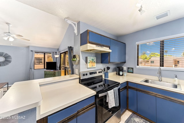 7612 E Callisto Cir Unit 60, Tucson, AZ 85715 - kitchen with stainless steel electric range oven, a sink, blue cabinets, under cabinet range hood, and lofted ceiling