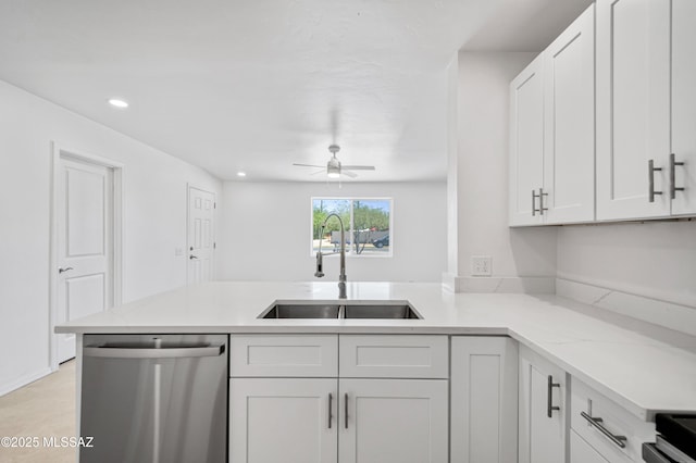 4167 E Los Robles St, Tucson, AZ 85712 - kitchen with dishwasher, a sink, a peninsula, white cabinets, and a ceiling fan