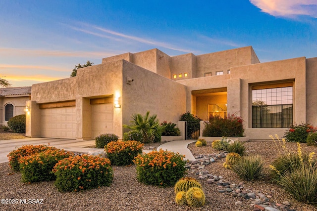 1920 W Canada Hills Dr, Oro Valley, AZ 85737 - southwest-style home with an attached garage, concrete driveway, and stucco siding