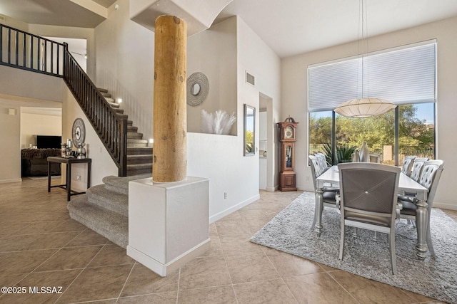 1920 W Canada Hills Dr, Oro Valley, AZ 85737 - dining room with a high ceiling, tile patterned floors, stairway, and baseboards