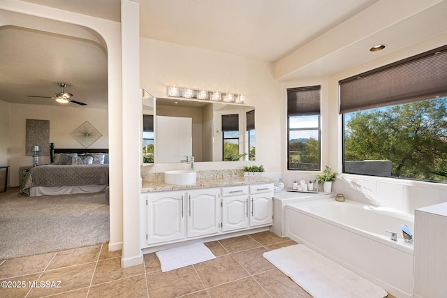 1920 W Canada Hills Dr, Oro Valley, AZ 85737 - full bath featuring connected bathroom, tile patterned floors, a garden tub, vanity, and ceiling fan