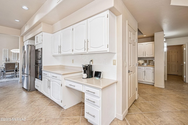 1920 W Canada Hills Dr, Oro Valley, AZ 85737 - kitchen with freestanding refrigerator, oven, decorative backsplash, white cabinetry, and light countertops