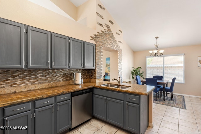 9141 E Bell Cactus Ln, Tucson, AZ 85715 - kitchen with dishwasher, a sink, light tile patterned flooring, a chandelier, and a peninsula
