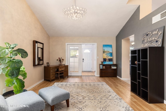 9141 E Bell Cactus Ln, Tucson, AZ 85715 - entrance foyer with a chandelier, light wood-style floors, baseboards, and high vaulted ceiling