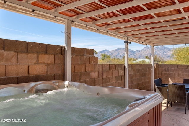 9141 E Bell Cactus Ln, Tucson, AZ 85715 - view of patio featuring a hot tub and a mountain view