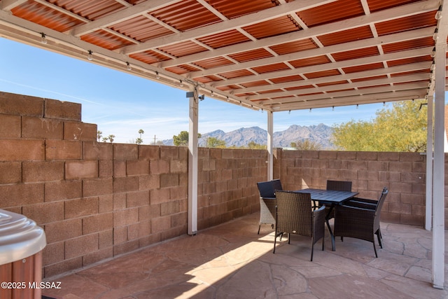 9141 E Bell Cactus Ln, Tucson, AZ 85715 - view of patio featuring a mountain view and outdoor dining space
