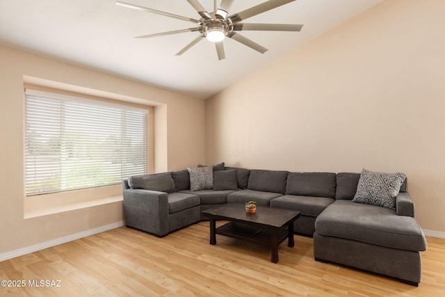 9141 E Bell Cactus Ln, Tucson, AZ 85715 - living area with light wood-style floors, lofted ceiling, baseboards, and a ceiling fan