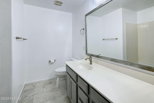 11710 W Boll Bloom Dr, Marana, AZ 85653 - full bathroom featuring baseboards, toilet, and vanity
