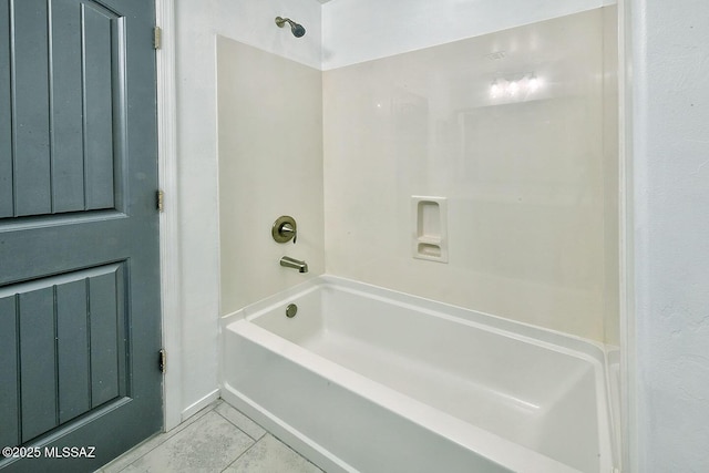 11710 W Boll Bloom Dr, Marana, AZ 85653 - bathroom with tile patterned floors and washtub / shower combination